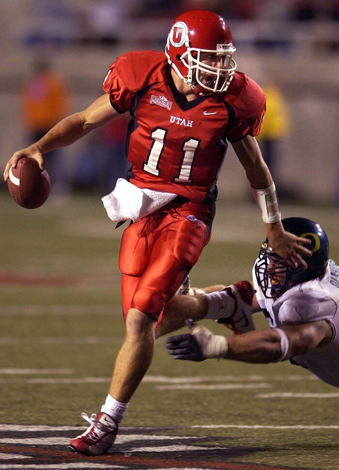 (Trent Nelson | Tribune file photo) Utah quarterback Alex Smith scrambles out of the reach of Oregon's Igor Olshansky in at college football game at Rice-Eccles Stadium in Salt Lake City, Friday, Oct. 3, 2003.