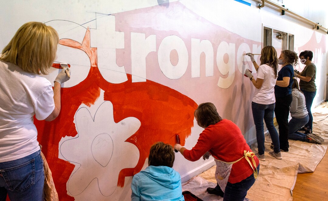 (Rick Egan | The Salt Lake Tribune) ​First Lady Abby Cox and legislative spouses and partners work on a mural art the  Utah YWCA, during a day of service. According to the media advisory, the project marks the first public-facing event hosted by the First Lady, and involves painting of two pre-traced murals located in common areas utilized by YWCA shelter and housing residents. The murals reflect the YWCA’s mission of eliminating racism and empowering women. Tuesday, March 2, 2021.