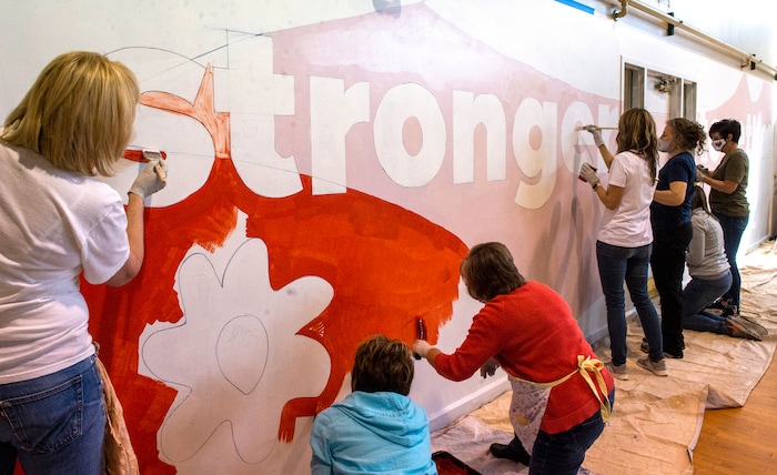 (Rick Egan | The Salt Lake Tribune) First Lady Abby Cox and legislative spouses and partners work on a mural art the Utah YWCA, during a day of service. According to the media advisory, the project marks the first public-facing event hosted by the First Lady, and involves painting of two pre-traced murals located in common areas utilized by YWCA shelter and housing residents. The murals reflect the YWCA’s mission of eliminating racism and empowering women. Tuesday, March 2, 2021.