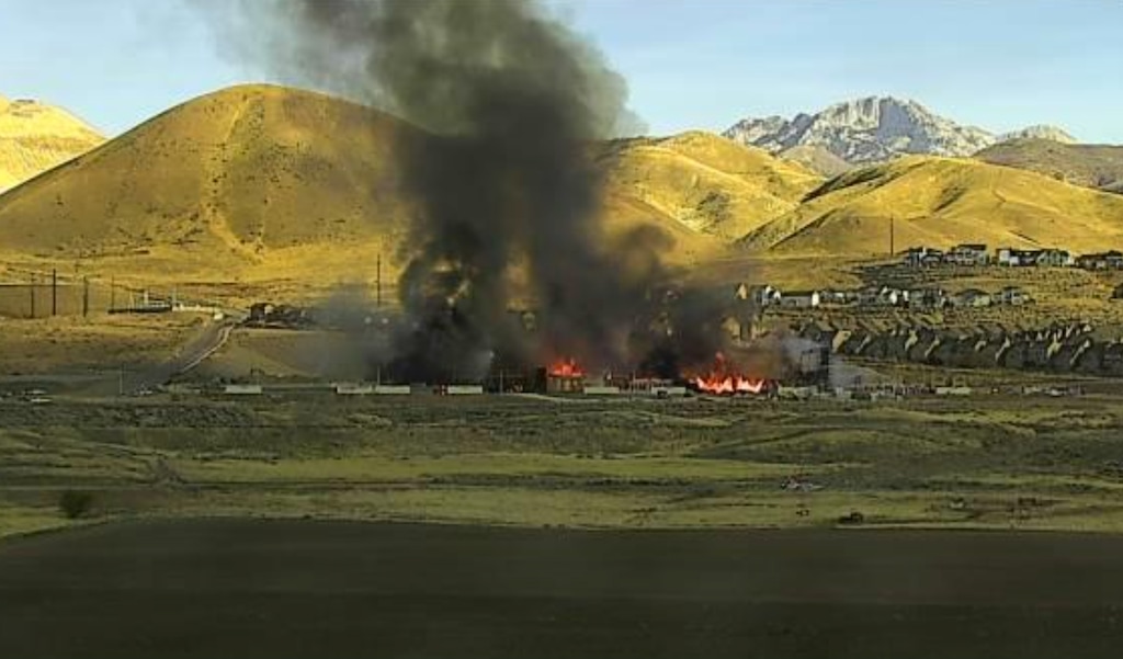 (Utah Department of Transportation) A massive fire can be seen burning on Traverse Mountain in Lehi on Sunday, Nov. 9, 2025.