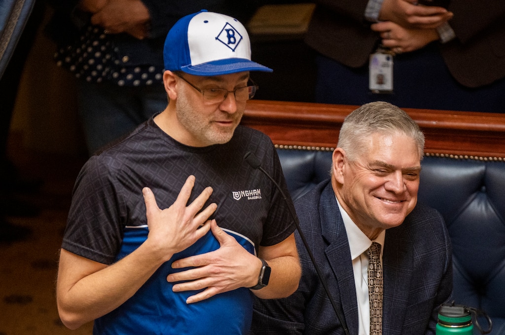 (Rick Egan | The Salt Lake Tribune) Sen. Lincoln Fillmore, R-South Jordan, sports his little league baseball coach uniform next to Dale Murphy in the Senate chambers as he discusses the possibility of bringing Major League Baseball to Utah, Tuesday, Jan. 23, 2024.