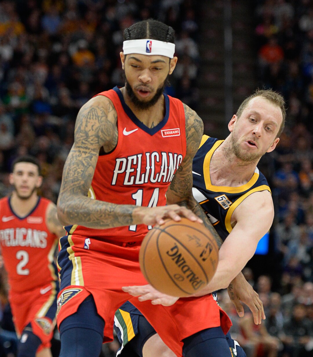 (Francisco Kjolseth  |  The Salt Lake Tribune)  Utah Jazz forward Joe Ingles (2) reaches in for the ball against New Orleans Pelicans forward Brandon Ingram (14) as the Utah Jazz host the New Orleans Pelicans in their NBA basketball game at Vivint Smart Home Arena in Salt Lake City on Sat. Nov. 23, 2019.