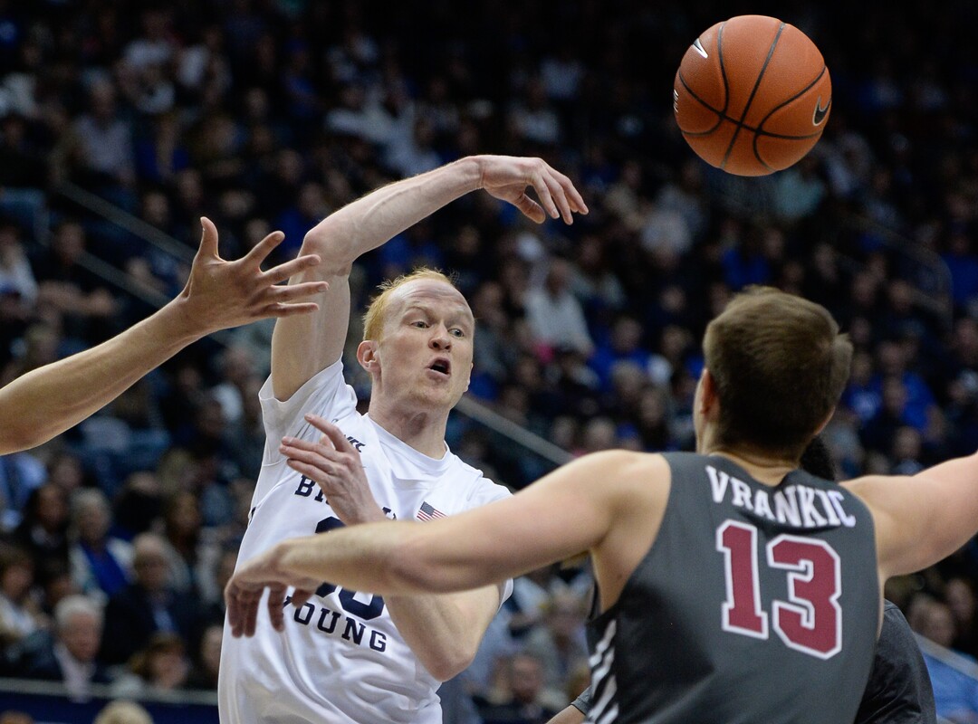 (Francisco Kjolseth  |  The Salt Lake Tribune) Brigham Young Cougars guard TJ Haws (30) passes to a teammate over Santa Clara Broncos forward Josip Vrankic (13) in the second half as the Brigham Young Cougars host the Santa Clara Broncos at the Marriott Center in Provo, Thursday, Feb. 20, 2020. BYU won 85-75.