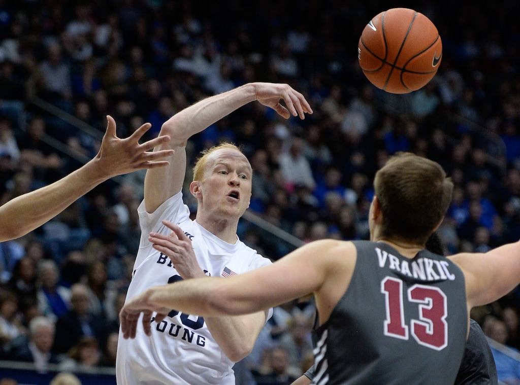 (Francisco Kjolseth | The Salt Lake Tribune) Brigham Young Cougars guard TJ Haws (30) passes to a teammate over Santa Clara Broncos forward Josip Vrankic (13) in the second half as the Brigham Young Cougars host the Santa Clara Broncos at the Marriott Center in Provo, Thursday, Feb. 20, 2020. BYU won 85-75.