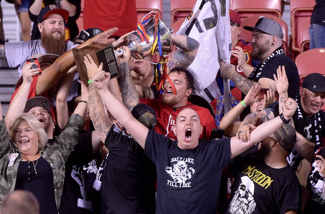 (Leah Hogsten  |  The Salt Lake Tribune) Real Salt Lake fans hoist up the Rocky Mountain Cup with the team. Real Salt Lake defeated the Colorado Rapids 4-1 for the Rocky Mountain Cup at Rio Tinto Stadium, Saturday, August 26, 2017. 