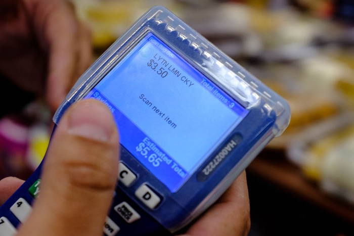 (Trent Nelson | The Salt Lake Tribune)  
Smith's has introduced handheld scanners to five Utah stores - where shoppers carry a small device and scan and bag their groceries as they walk through the aisles. Adrian Ortega demonstrated one of the units at the Rose Park store, Monday April 16, 2018.