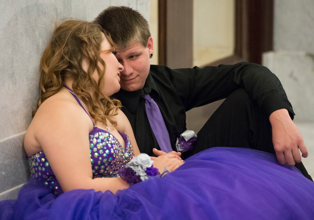 (Leah Hogsten  |  The Salt Lake Tribune) Utah Virtual Academy student Carolann Christensen and Kaleb Miller give their feet a rest in between songs. Three virtual charter schools, Utah Virtual Academy, Utah Connections Academy and Mountain Heights Academy, co-hosted prom for their students, Friday, April 27, 2018. 
