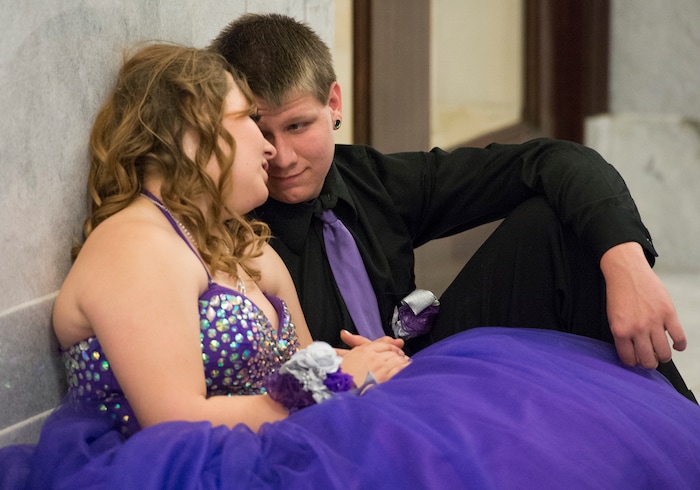 (Leah Hogsten  |  The Salt Lake Tribune) Utah Virtual Academy student Carolann Christensen and Kaleb Miller give their feet a rest in between songs. Three virtual charter schools, Utah Virtual Academy, Utah Connections Academy and Mountain Heights Academy, co-hosted prom for their students, Friday, April 27, 2018. 