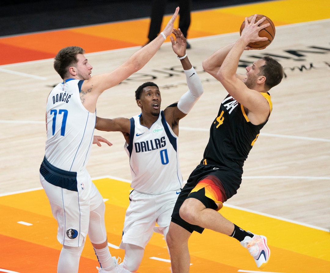(Rick Egan | The Salt Lake Tribune)  Utah Jazz forward Bojan Bogdanovic (44) shoots as Dallas Mavericks guard Josh Richardson (0) and Dallas Mavericks guard Luka Doncic (77) defend, in NBA action between the Utah Jazz and the Dallas Mavericks at Vivint Arena, on Friday, Jan. 29, 2021.