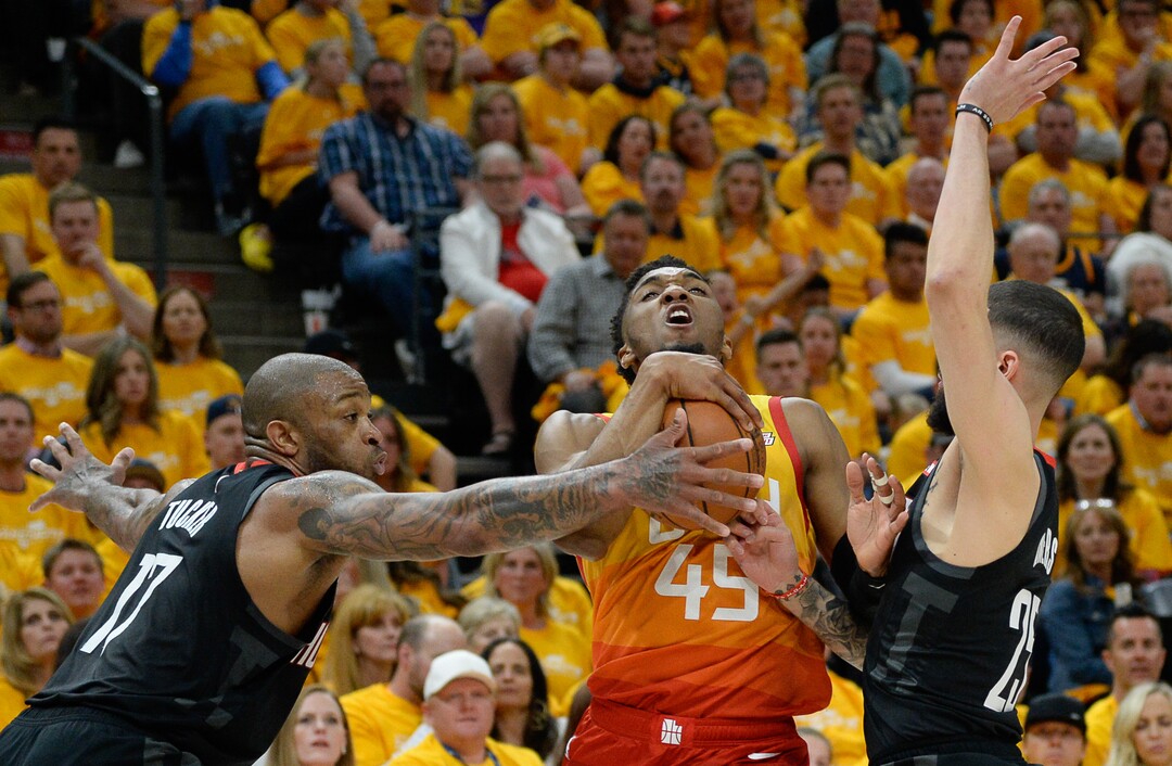 (Francisco Kjolseth  |  The Salt Lake Tribune)  Houston Rockets forward PJ Tucker (17) and Houston Rockets guard Austin Rivers (25) put the squeeze on Utah Jazz guard Donovan Mitchell (45) in Game 3 of a first-round NBA basketball playoff series in Salt Lake City, Saturday, April 20, 2019.