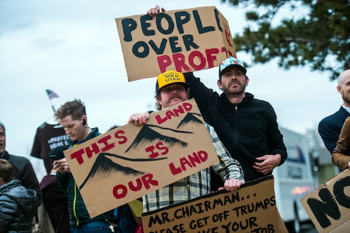 Chris Detrick  |  The Salt Lake Tribune
Ty Hess, left, and Jessee Brown, both of Salt Lake City, hold their signs before the town-hall meeting with U.S. Rep. Jason Chaffetz, R-Utah, outside of Brighton High School Thursday February 9, 2017. 