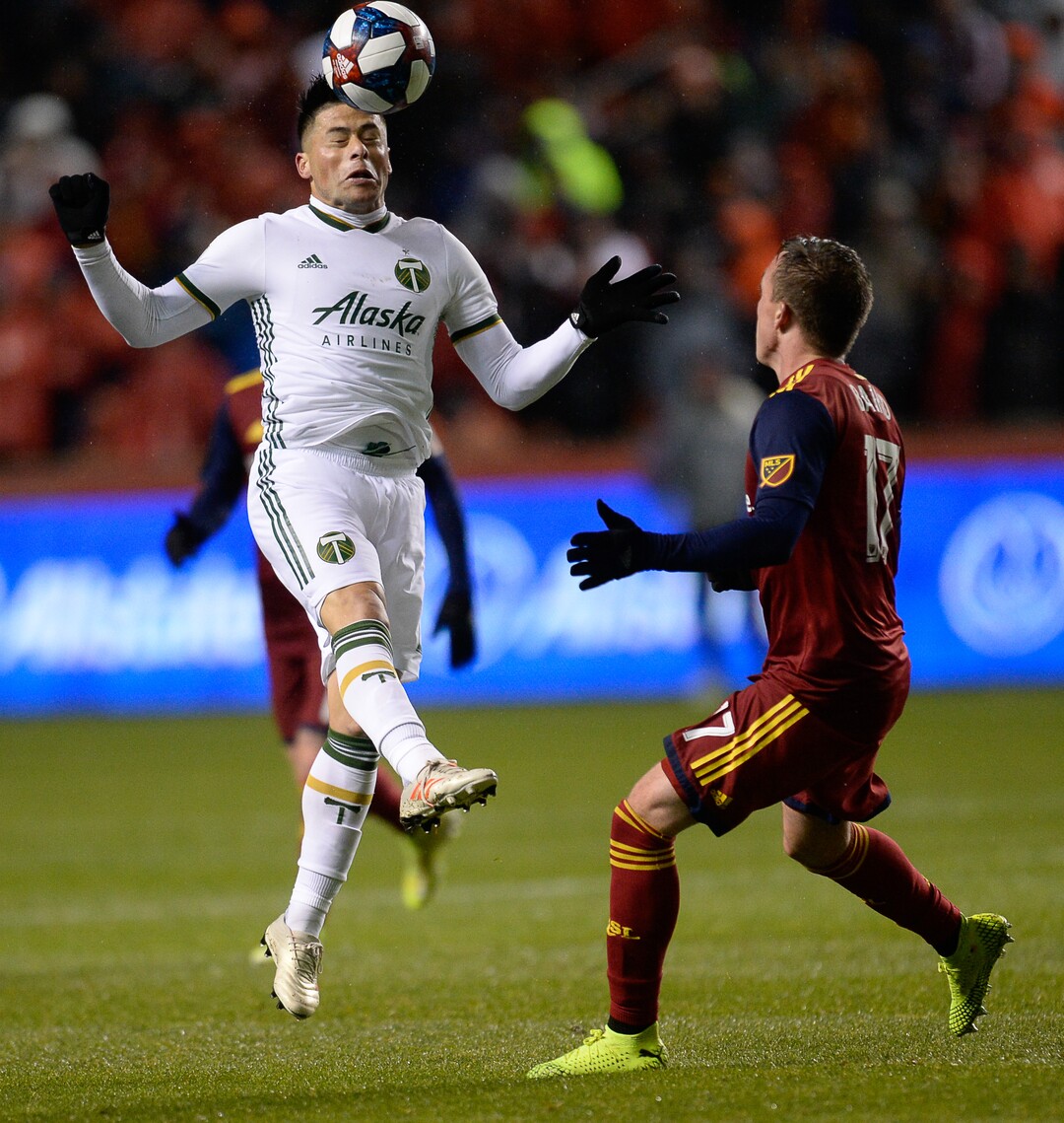 (Francisco Kjolseth  |  The Salt Lake Tribune)  Portland Timbers defender Jorge Moreira (2) takes a head shot ahead of Real Salt Lake forward Corey Baird (17) as Real Salt Lake and the Portland Timbers play in their first MLS playoff game at Rio Tinto Stadium in Sandy, Utah on Saturday, Oct. 19, 2019.