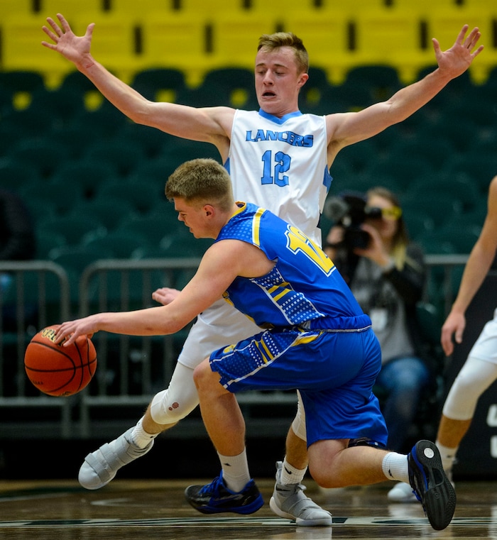 (Steve Griffin  |  The Salt Lake Tribune) Layton's Truman Brown blocks the path of Cyprus guard Logan Hendrickson during 6A basketball playoff game at the Utah Valley UniversityÕs UCCU Center in Provo Tuesday Feb. 27, 2018.