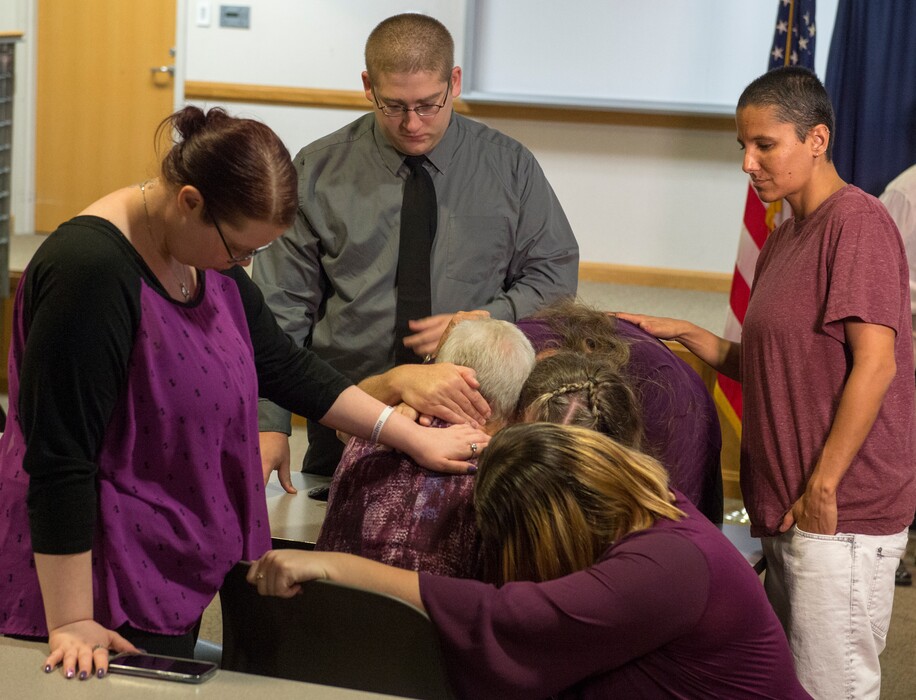 (Rick Egan  |  The Salt Lake Tribune) Family members hug Valerie Brantzeg's mother, Juanita Dikes, at the Salt Lake County Sheriff's office, Friday, Sept. 7, 2018. Sim Gill, the Salt Lake County District Attorney, announced formal charges against Valerie Brantzeg's estranged husband, Walter Brantzeg, in her beating death.