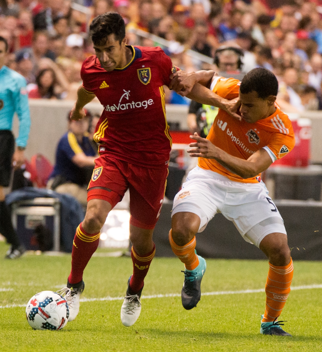 (Rick Egan  |  The Salt Lake Tribune)  Real Salt Lake defender Tony Beltran (2) got for the ball along with Houston Dynamo midfielder Juan Cabezas (5), in MLS action, Real Salt Lake Vs. Houston Dynamo, in Sandy, Saturday, August 5, 2017.