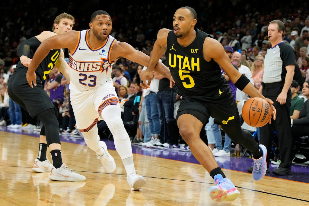 (Rick Scuteri | AP) Utah Jazz guard Talen Horton-Tucker (5) drives against Phoenix Suns guard Eric Gordon during the first half of an NBA basketball game Saturday, Oct. 28, 2023, in Phoenix.