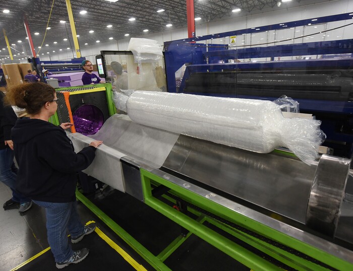 (Francisco Kjolseth | The Salt Lake Tribune)  Purple, an Alpine based company that has developed tech to manufacture flexible mattresses at a plant in Grantsville, is among many Utah companies that are categorized as important "high growth" companies in Utah and Salt Lake counties. Here a special machine compresses the mattresses and rolls them before they are sleeved for shipment to the customer. 
