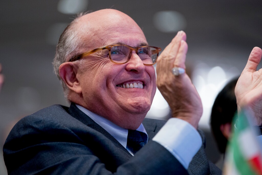 (Andrew Harnik | The Associated Press) Rudy Giuliani, an attorney for President Donald Trump, applauds at the Iran Freedom Convention for Human Rights and democracy at the Grand Hyatt, Saturday, May 5, 2018, in Washington.