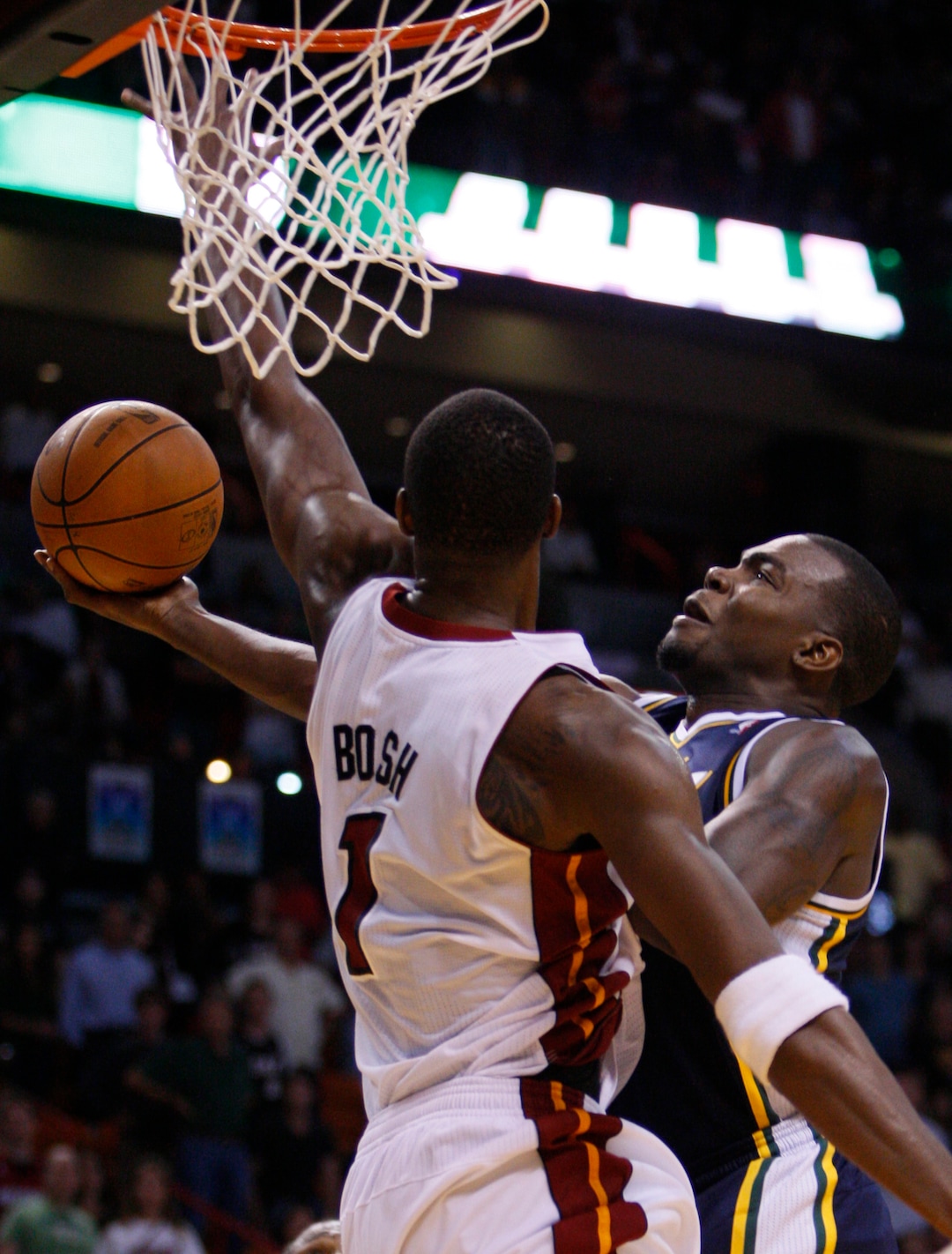 (Wilfredo Lee | AP file photo) Utah Jazz power forward Paul Millsap goes up for a shot against Miami Heat power forward Chris Bosh (1) during overtime in an NBA basketball game Tuesday, Nov. 9, 2010 in Miami. Millsap scored a career-high 46 points as the Jazz defeated the Heat 116-114 in overtime.