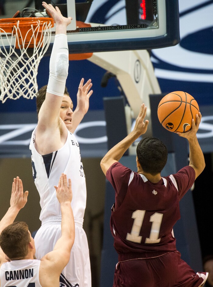 (Rick Egan  |  The Salt Lake Tribune)   Texas Southern Tigers guard Brian Carey (11) shoots as Brigham Young Cougars forward Payton Dastrup (15) defends, in basketball action, Brigham Young Cougars vs Texas Southern Tigers, at the Marriott Center in Provo, Saturday, December 23, 2017.