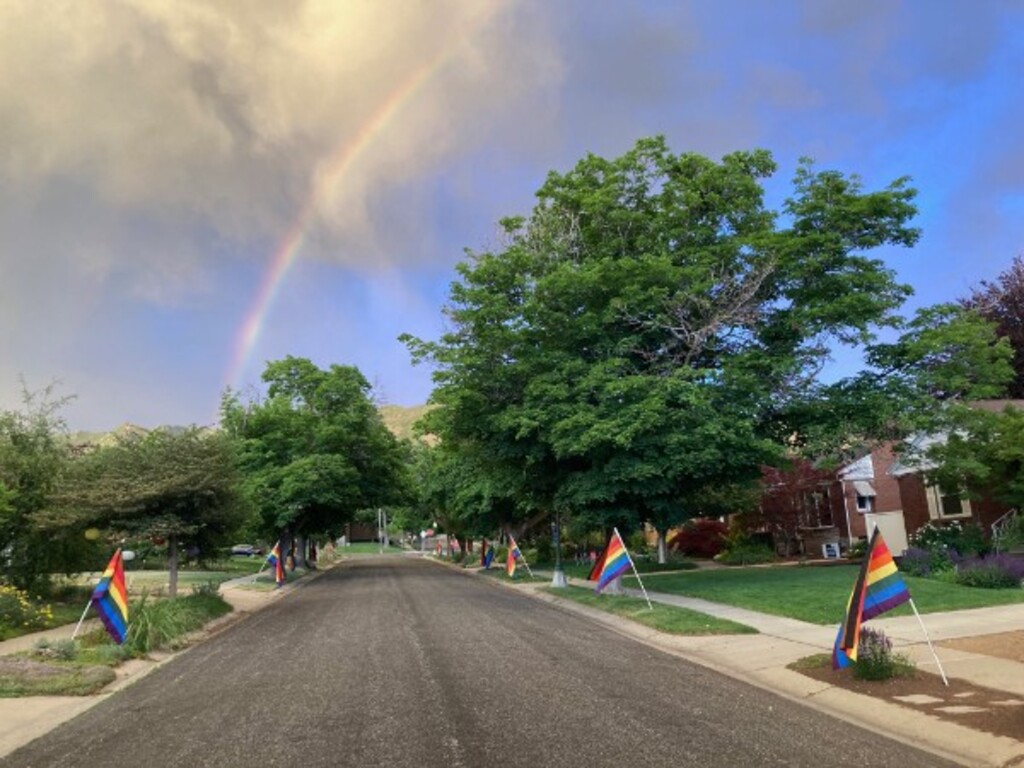 (Daniel Horns) A rainbow can be seen in the sky above a Salt Lake City neighborhood near 2100 East and Roosevelt Avenue, where residents lined the street with pride flags to celebrate Pride Month. The flags were stolen sometime between June 8 and June 9, 2023, a neighbor said.