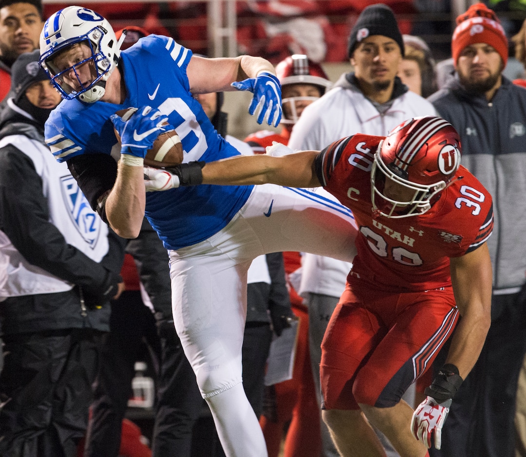 (Rick Egan  |  The Salt Lake Tribune)        Brigham Young Cougars tight end Matt Bushman (89) grabs a one handed pass, as Utah Utes linebacker Cody Barton (30) defends, in football action between the Brigham Young Cougars and the Utah Utes, at Rice-Eccles Stadium, Saturday, November 24, 2018.