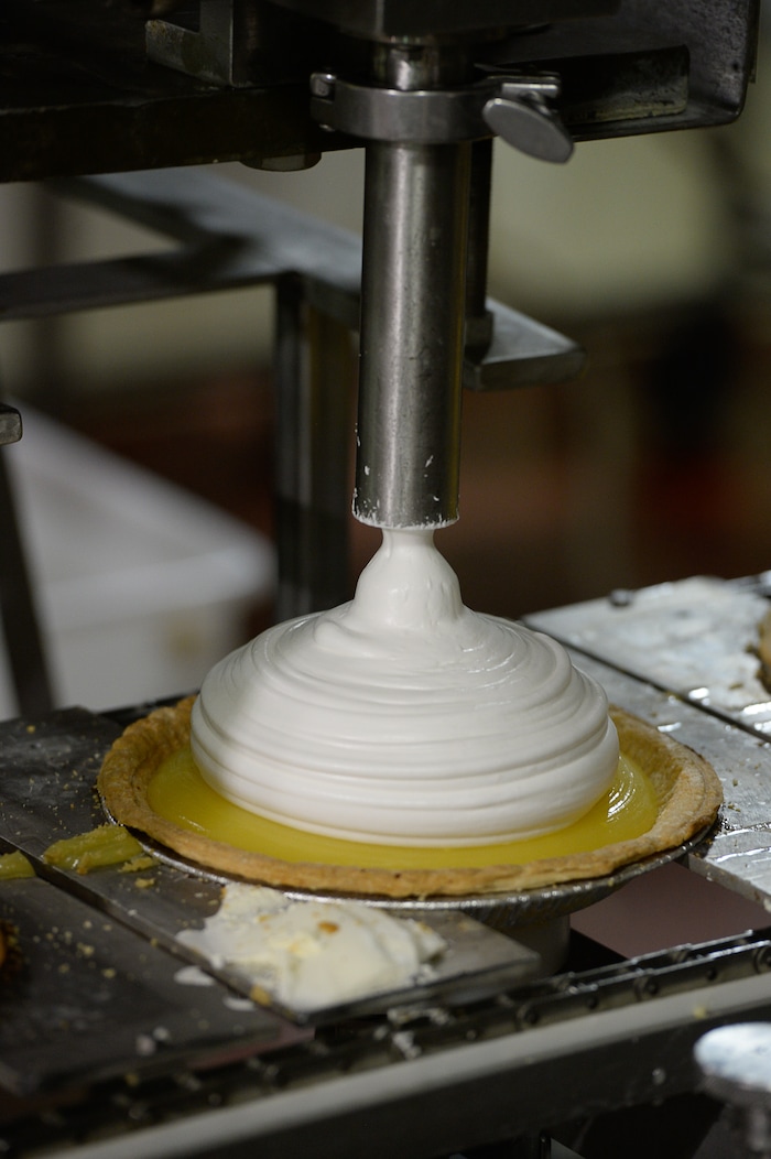 Francisco Kjolseth | The Salt Lake TribuneLemon meringue pies get their filling at Rocky Mountain Pie factory where the pies are made. Some of the winning pie flavors produced include sea salt caramel chocolate, pumpkin chiffon, strawberry margarita, banana cream, peach raspberry galette and cherry almond praline.