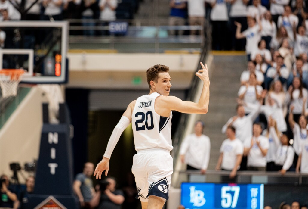 (Rachel Rydalch | The Salt Lake Tribune) Brigham Young Cougars guard Spencer Johnson (20) celebrates after making a three-point shot during a game against the Long Beach State 49ers at the Marriott Center on Wednesday, March 16, 2022.