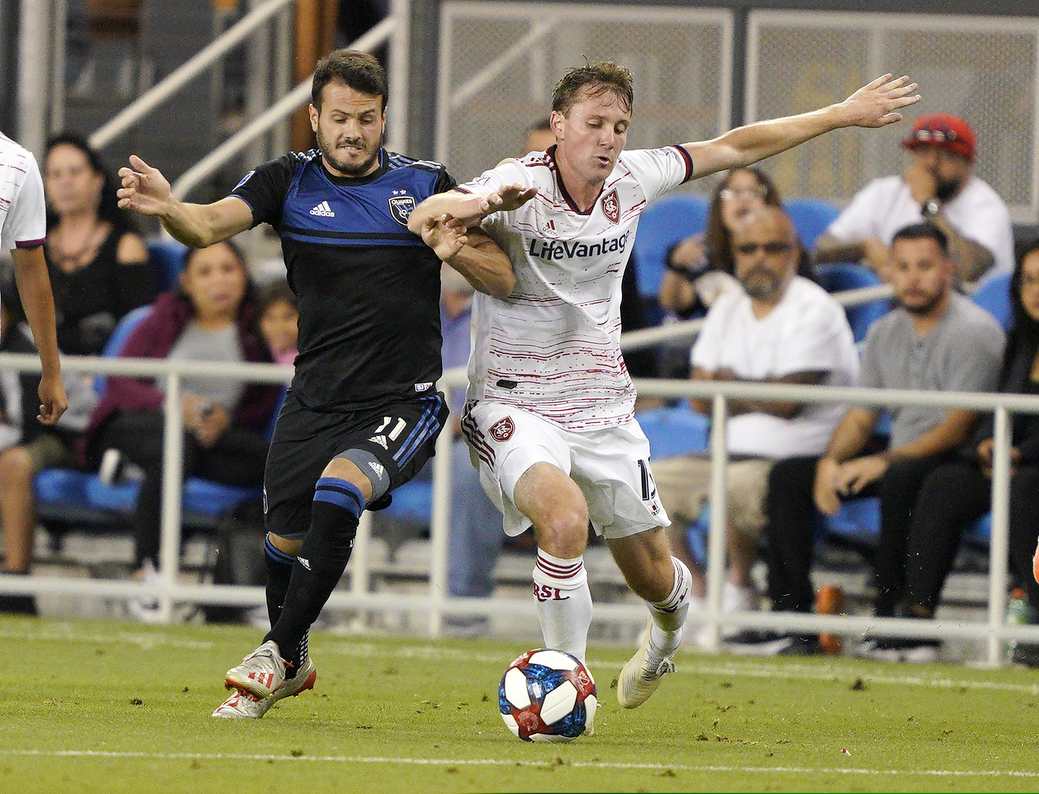 San Jose Earthquakes midfielder Valeri Kazaishvili (11) works for the ball against Real Salt Lake midfielder Nick Besler (13) during the second half of an MLS soccer match Saturday, July 6, 2019, in San Jose, Calif. San Jose won 1-0. (AP Photo/Tony Avelar)