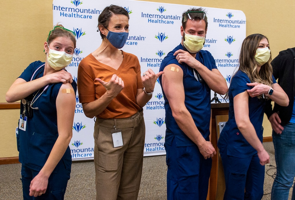 (Rick Egan | The Salt Lake Tribune) Sophie Woodbury, Dr. Angela Dunn, Monte Roberts and Amanda Vicchrilli pose for a photo after the first Covid-19 vaccines were administered at LDS Hospital, on Tuesday, Dec. 15, 2020.