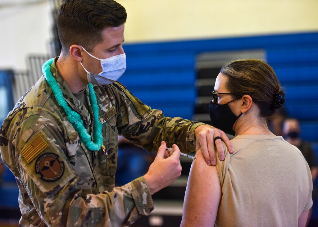 (U.S. Air Force Tech. Sgt. Anthony Nelson Jr./Department of Defense via AP) In this Feb. 9, 2021 photo provided by the Department of Defense, Hickam 15th Medical Group host the first COVID-19 mass vaccination on Joint Base Pearl Harbor-Hickam in Hawaii. Some Utah politicians are backing a provision of the NDAA that would end the military's COVID-19 vaccine mandate.