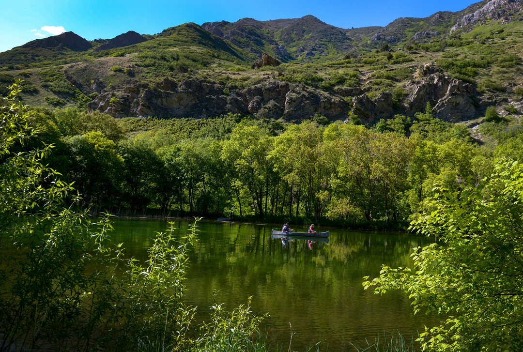 (Leah Hogsten  |  The Salt Lake Tribune) BSA Camp Tracy employees James Jette, 18, and Hensley Ballamis paddle around Taylor Lake, Thursday, May 24, 2018. The two will serve as lifeguards at Camp Tracy for the 2018 summer season. 