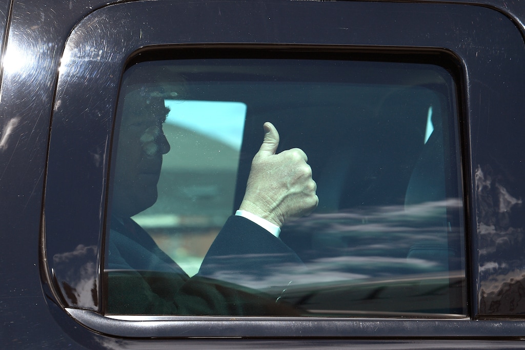 President Donald Trump gives thumbs up as his motorcade arrives near Air Force One at Andrews Air Force Base, Md., Monday, April 15, 2019. Trump is heading to Minnesota to tout the 2017 tax law. (AP Photo/Susan Walsh)