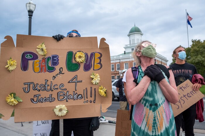 (Leah Hogsten | The Salt Lake Tribune) Talon Baier and his mother Claren joined the march Monday. Black Lives Matter supporters and Salt Lake Equal Rights Movement members march from the Capitol to Washington Square on Monday, August 31, 2020 calling for justice for Jacob Blake who was shot in the back by police in Kenosha, Wisconsin on August 23rd.