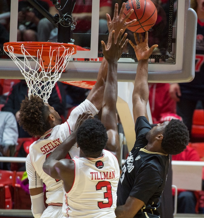 (Rick Egan  |  The Salt Lake Tribune)  Utah Utes forward Chris Seeley (11) and Utah Utes forward Donnie Tillman (3) block a shot by Colorado Buffaloes guard Namon Wright (13), in PAC-12 basketball action between Utah Utes and Colorado Buffaloes, at the Jon M. Huntsman Center, Saturday, March 3, 2018.