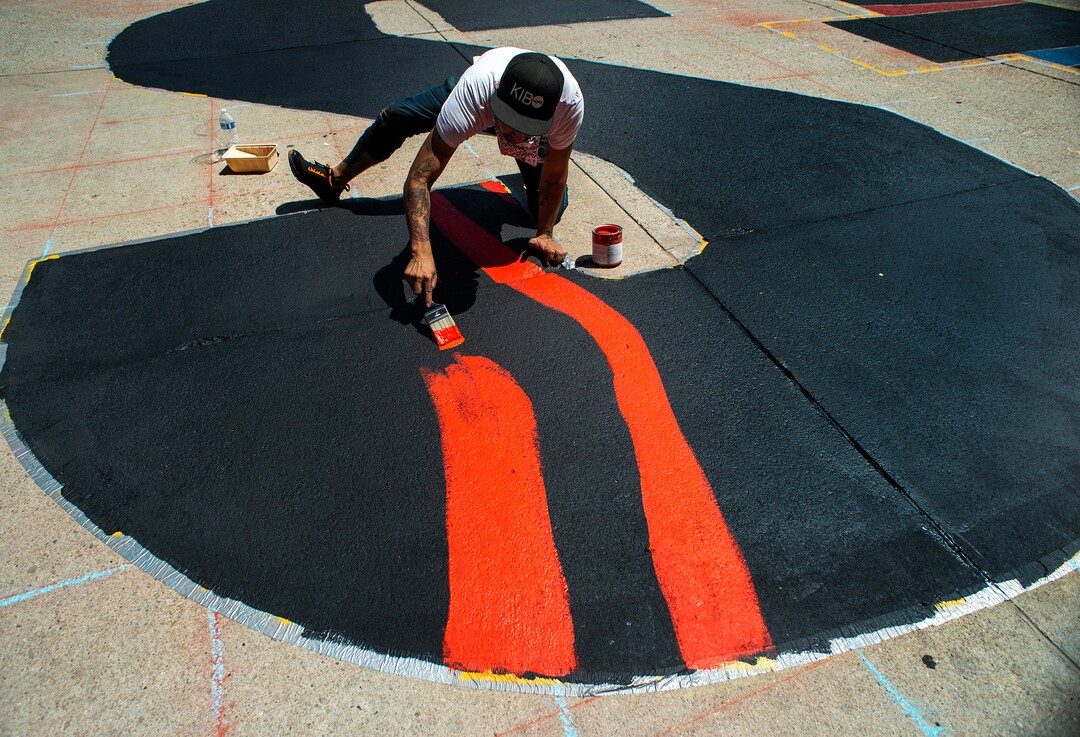 (Rick Egan  |  The Salt Lake Tribune)    Artist Chandara Chuon, works on the letter ÒSÓ in  the Black Lives Matter mural, on the south side of Salt Lake City Hall on Tuesday, Aug. 4, 2020.