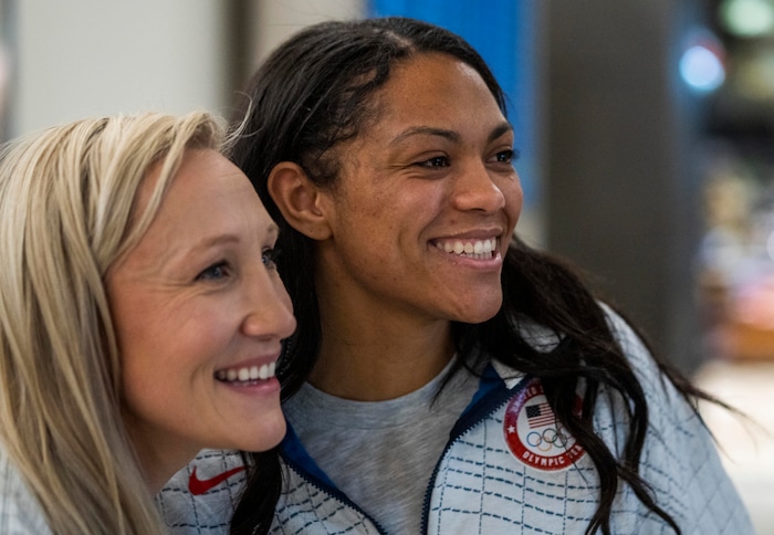 (Rick Egan | The Salt Lake Tribune) Kaillie Humphries, left, poses for a photo with two-woman bobsled teammate, Kaysha Love from Herriman, as they and other Team USA Olympians arrive at the Salt Lake City International Airport on Monday, Feb. 21, 2022.