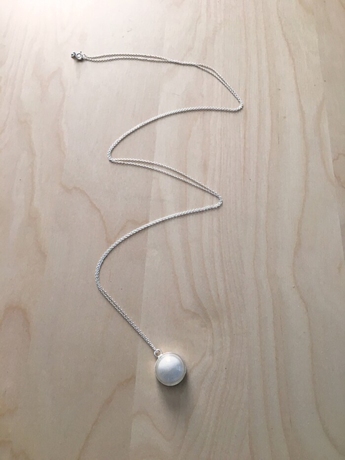 (Marina Gomberg | The Salt Lake Tribune) Marina made a necklace out of her breast milk. She knows that's weird, but she loves it because she thinks breast milk is amazing. This is how it turned out. Step 8: Purchase chain when you realize one wasn't included. Then enjoy.