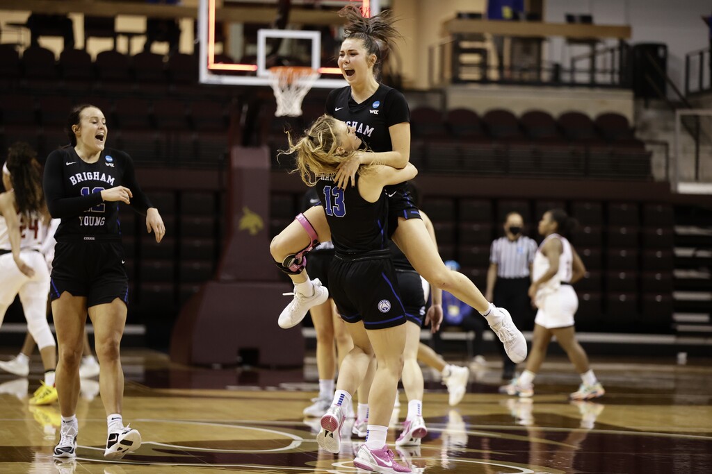 (Photo courtesy of BYU Athletics) | BYU players celebrate after the 11th-seeded Cougars rallied past No. 6 seed Rutgers on Monday in their NCAA Tournament opener in San Antonio, Texas.