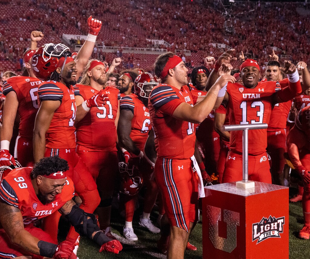 (Rick Egan | The Salt Lake Tribune) Utah Utes quarterback Bryson Barnes (16) and  quarterback Nate Johnson (13), celebrate with team mates after they light the U, after the Utes defeated the Florida Gators. At Rice-Eccles Stadium, on Thursday, Aug. 31, 2023.