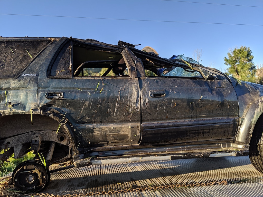 (Photo courtesty of the Utah Department of Transportation) Meagan Morgan, 18, was riding in this SUV when it rolled on July 4. She suffered a broken neck but survived because she was wearing a seat belt.