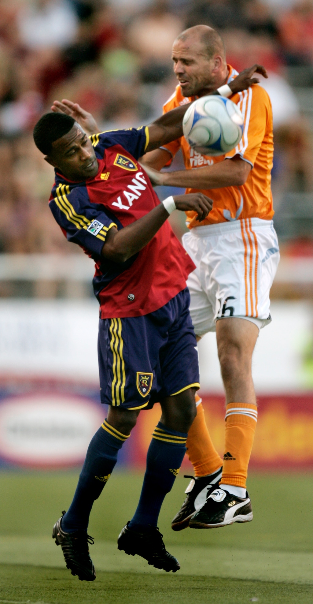 Real Salt Lake forward Robbie Findley and Houston Dynamo defender Craig Waibel (16) push each other as the ball drops past them during the first half of the MLS soccer game Thursday, July 3, 2008, in Salt Lake City. (AP Photo/Douglas C. Pizac)