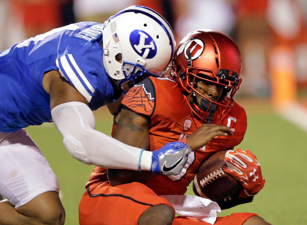BYU linebacker Fred Warner, left, sacks Utah quarterback Troy Williams, right, in the second half during an NCAA college football game Saturday, Sept. 10, 2016, in Salt Lake City. Utah won 20-19. (AP Photo/Rick Bowmer)