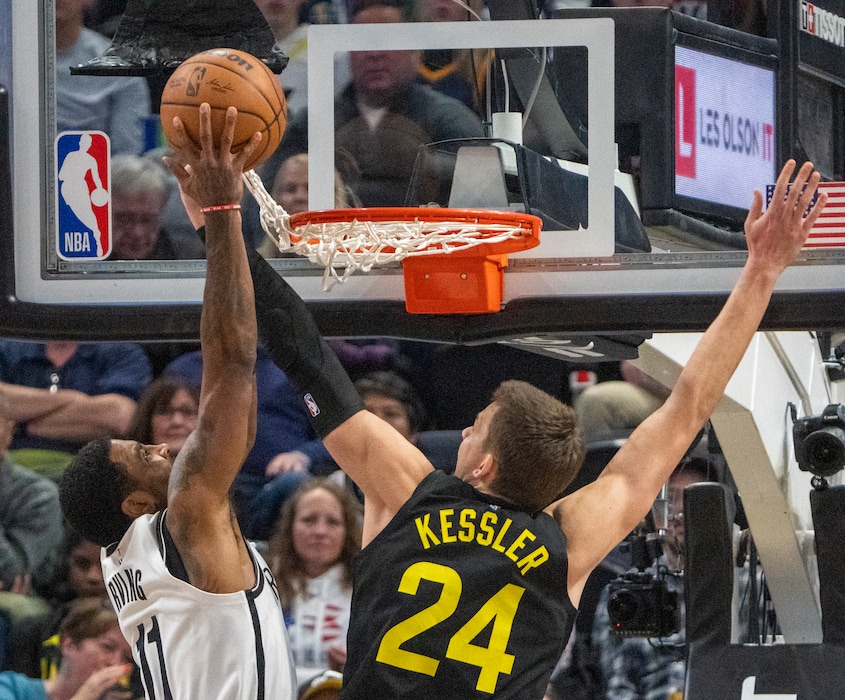 (Rick Egan | The Salt Lake Tribune) Brooklyn Nets guard Kyrie Irving (11) goes in for a dunk, as Utah Jazz center Walker Kessler (24) gets tangled up in the net, in NBA action between the Utah Jazz and the Brooklyn Nets at Vivint Arena, on Friday, Jan. 20, 2023.