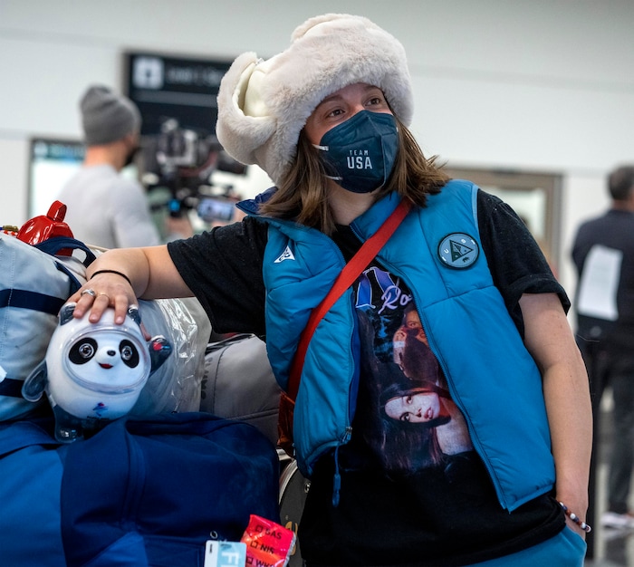 (Rick Egan | The Salt Lake Tribune) Freestyle skier Darian Stevens poses for a photo with Olympic mascot Bing Dwen Dwen, as she and other Team USA Olympians arrive at the Salt Lake City International Airport on Monday, Feb. 21, 2022.