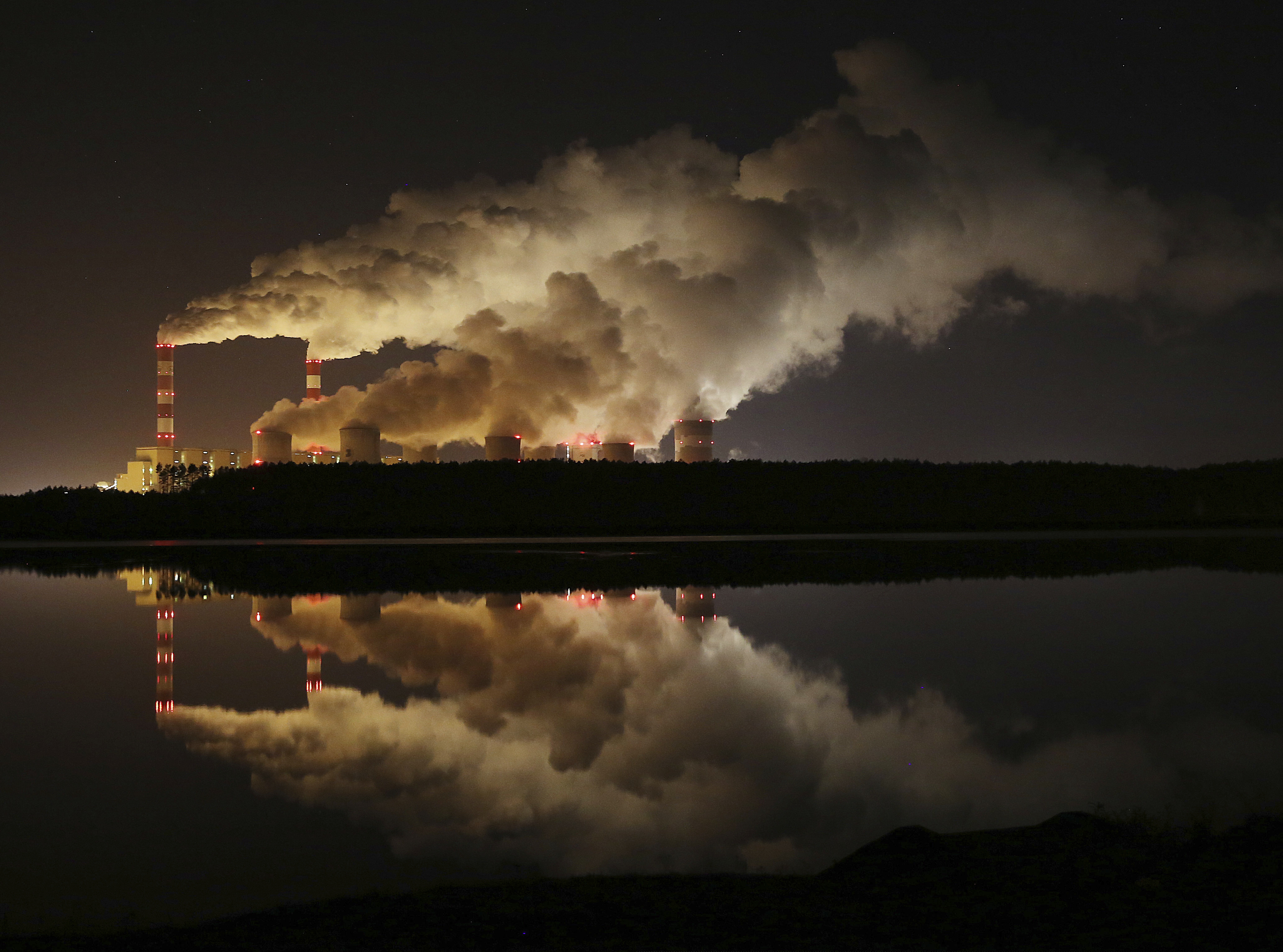 (Czarek Sokolowski | AP file photo) In this Wednesday, Nov. 28, 2018, file photo, plumes of smoke rise from Europe's largest lignite power plant in Belchatow, central Poland. After several years of little growth, global emissions of heat-trapping carbon dioxide surged in 2018 with the largest jump in seven years, discouraged scientists announced Wednesday, Dec. 5, 2018.