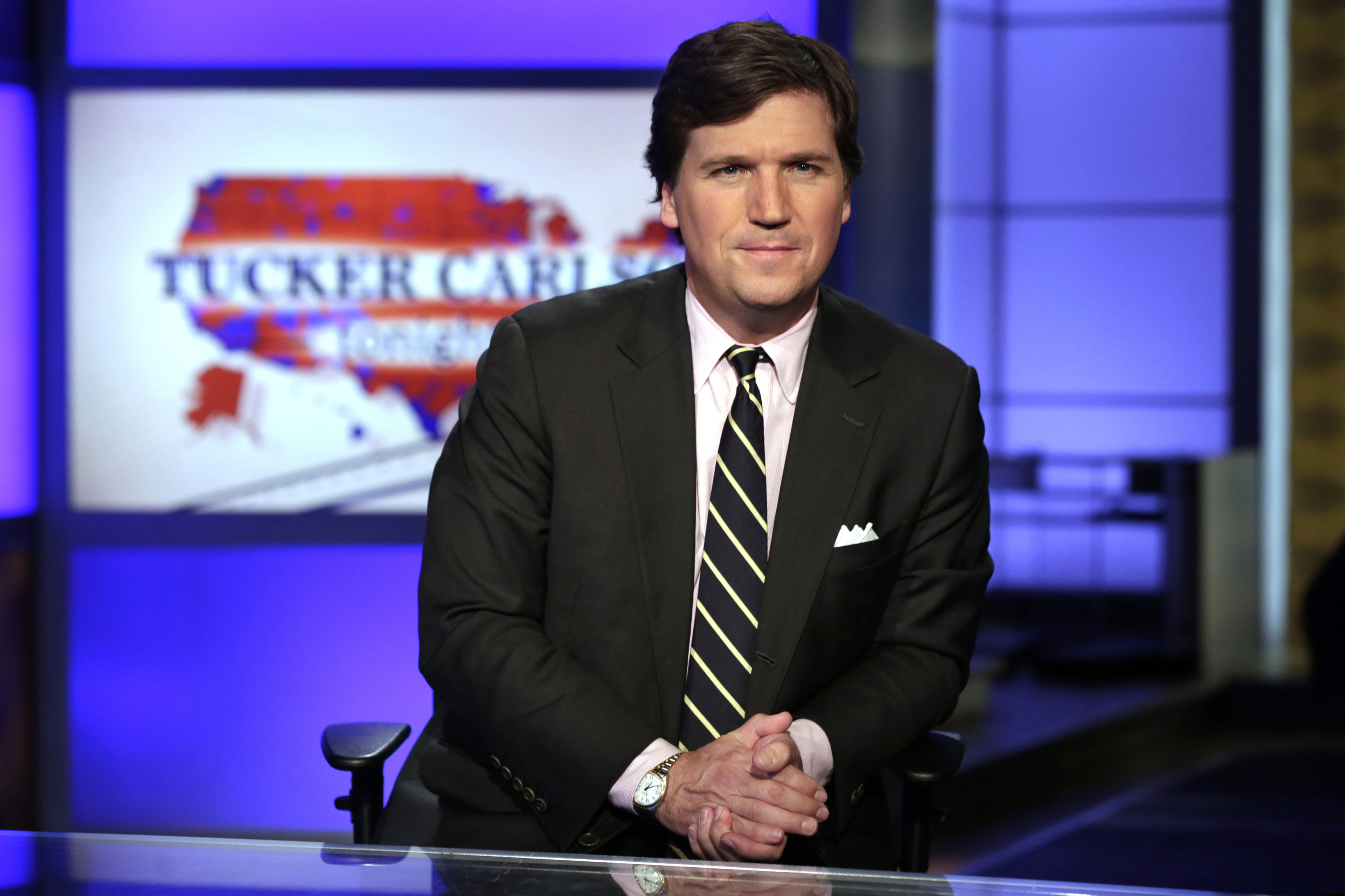 (Richard Drew | AP file photo) In this March 2, 2017, file photo, Tucker Carlson, host of "Tucker Carlson Tonight," poses for photos in a Fox News Channel studio, in New York.