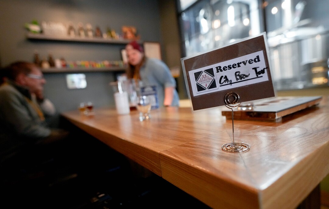 (Francisco Kjolseth | The Salt Lake Tribune) City Brew Tours in Salt Lake guide Liam Bice gives people a behind the scenes look at the process at Level Crossing Brewery on Saturday, April 30, 2022. The new educational beer tour takes folks around to local breweries to see the back end brewing process, sample beers and pair them with food. 