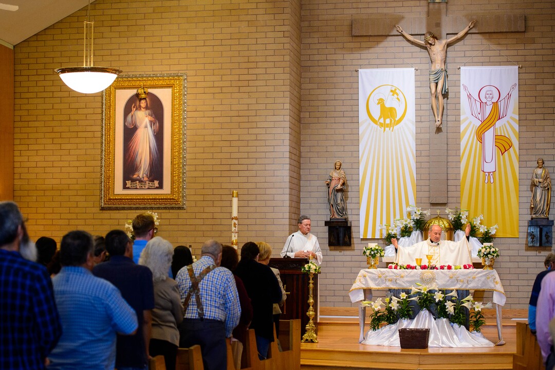 (Trent Nelson  |  The Salt Lake Tribune)  Rev. Francisco Pires leads Easter Mass at Saints Peter & Paul Catholic Church in West Valley City on Sunday April 21, 2019.