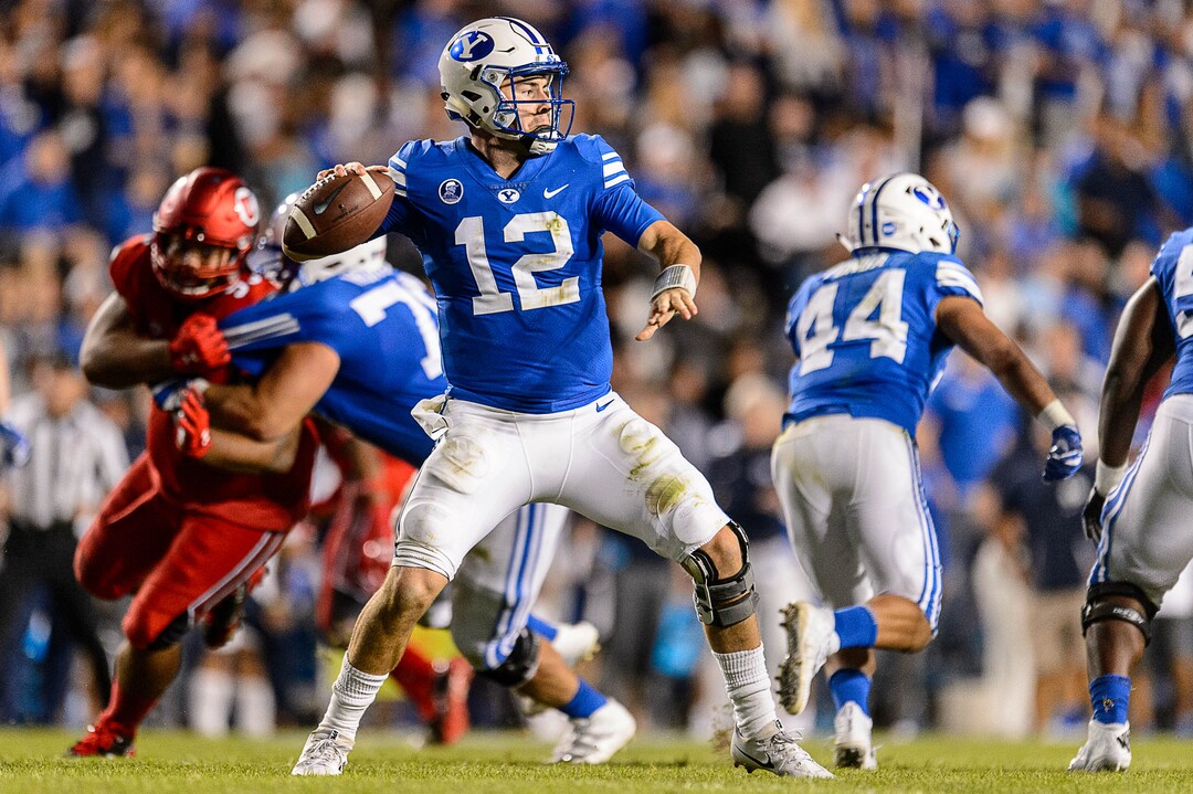 (Trent Nelson | The Salt Lake Tribune)  Brigham Young Cougars quarterback Tanner Mangum (12) throws the ball as BYU hosts Utah, NCAA football in Provo, Saturday September 9, 2017.